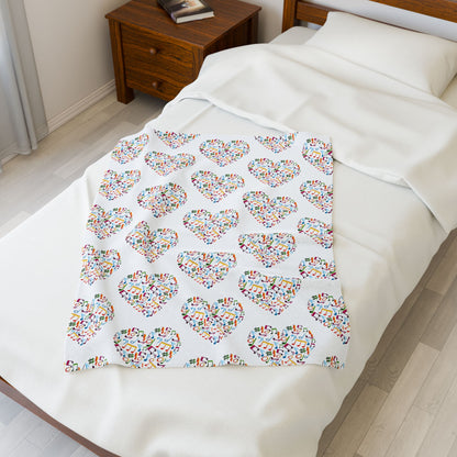 Hearts blanket with playful note and treble clef pattern