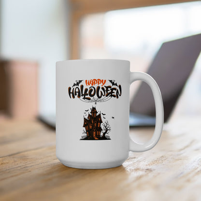 White mug with Halloween design featuring a haunted house on a wooden surface.