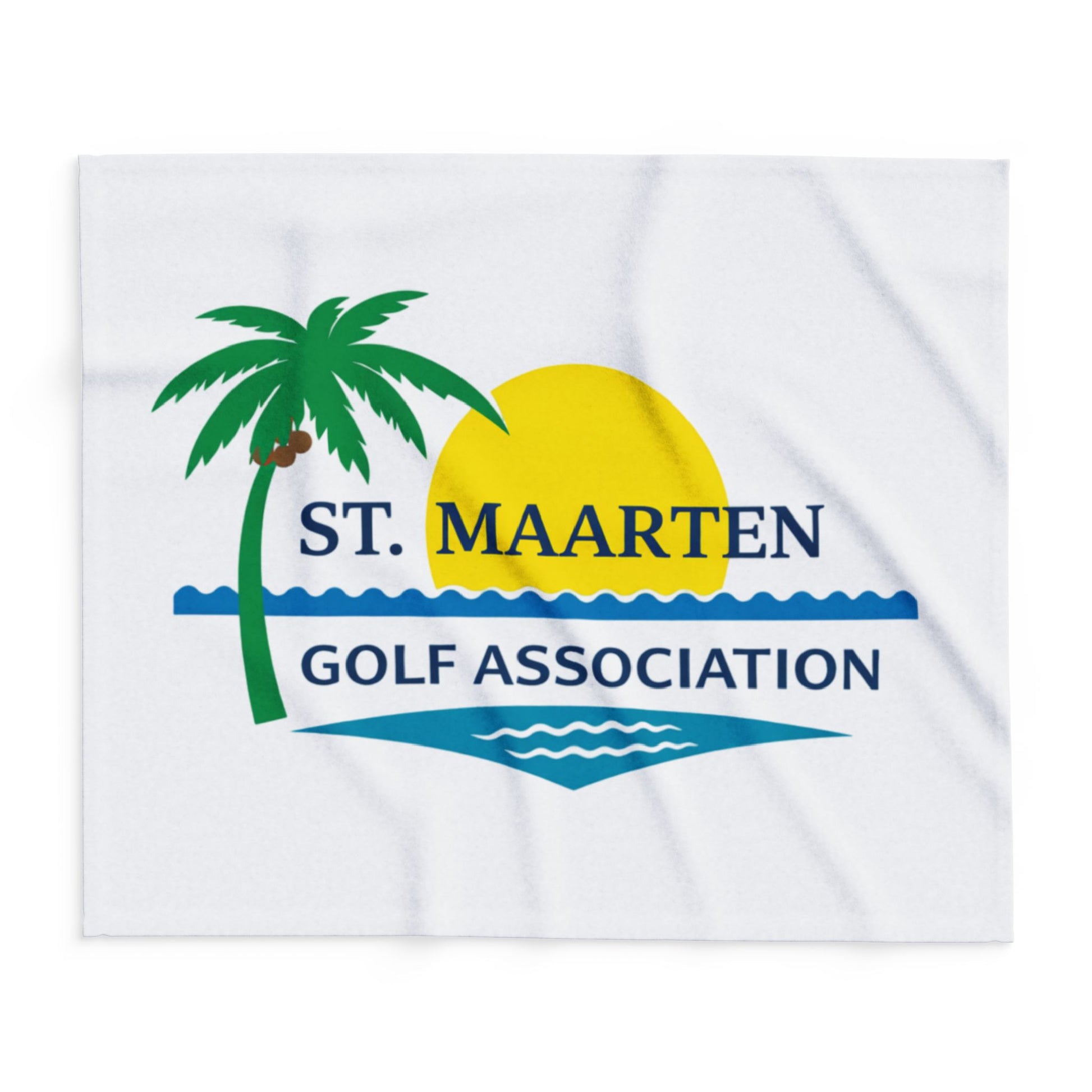 White towel with St. Maarten Golf Association logo featuring a palm tree, sun, and waves.
