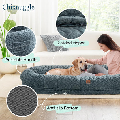 Dog bed with features highlighted, including a 2-sided zipper, portable handle, and anti-slip bottom, with a person petting a dog on a couch.