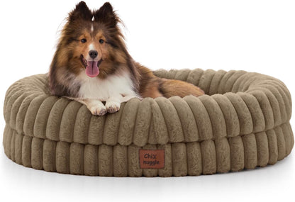 Dog lying on a brown plush dog bed with a visible brand label.