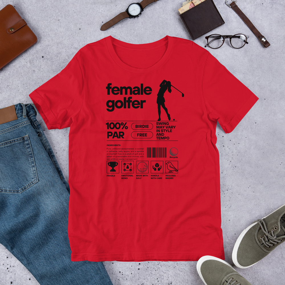 Red t-shirt with black ‘Female Golfer’ graphic design featuring golf icons and humorous label-style print.