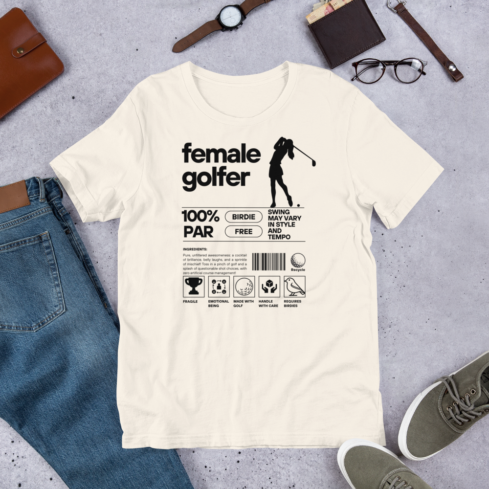 Creme t-shirt with black ‘Female Golfer’ graphic design featuring golf icons and humorous label-style print.
